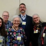 Marina Tolmacheva, front & center, smiles with and other members of MESA.