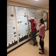 2 people read the history research posters.