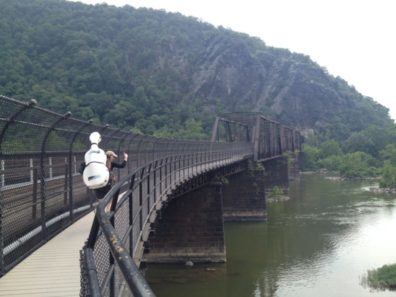 hiker on bridge