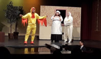 students perform on stage
