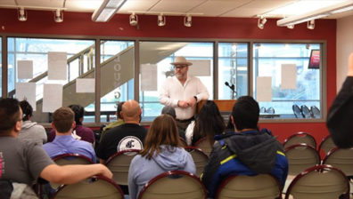 WSU Tri-Cities alumnus and instructor talks with students about being a first-generation, non-traditional student during a first-generation celebration event on campus