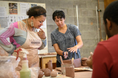 Io working with students in the sculpture studio