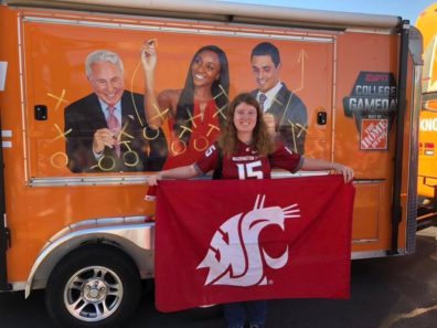 student with WSU flag and ESPN bus