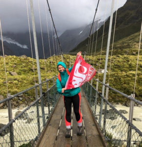 Emma displays the WSU flag during a hike (and break from studies) in New Zealand.