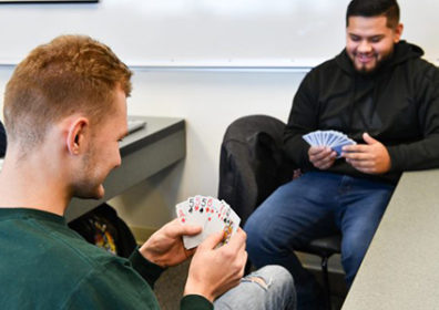 two men playing cards