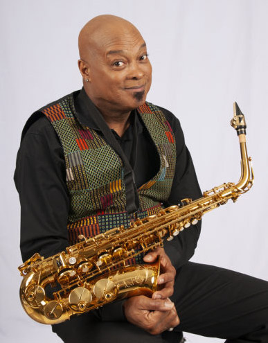 Horace Alexander Young with his saxophone in his hands.