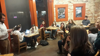People watching a poetry reading.