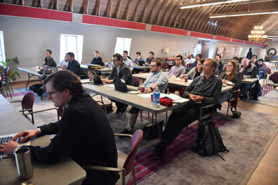 Workshop attendees at tables