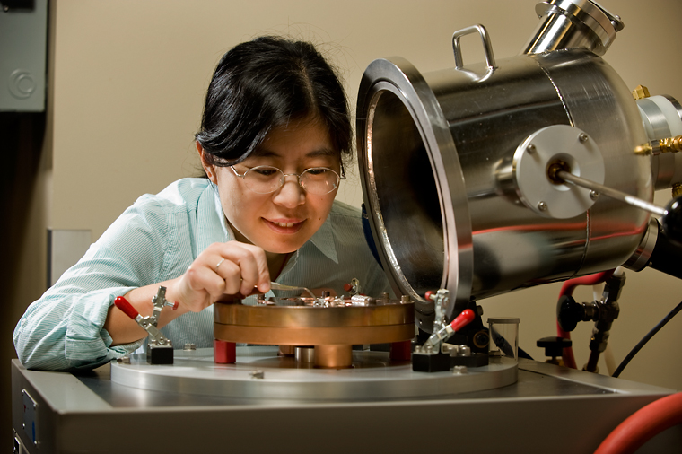 Grad student conducting an experiment in a shock physics lab