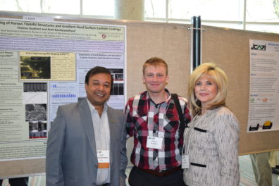 Dr. Bandyopadhyay and graduate student Tyler with Center of Excellence for Aerospace and Advanced Manufacturing Executive Director MaryKaye Bredeson. Photo courtesy of the Center of Excellence.