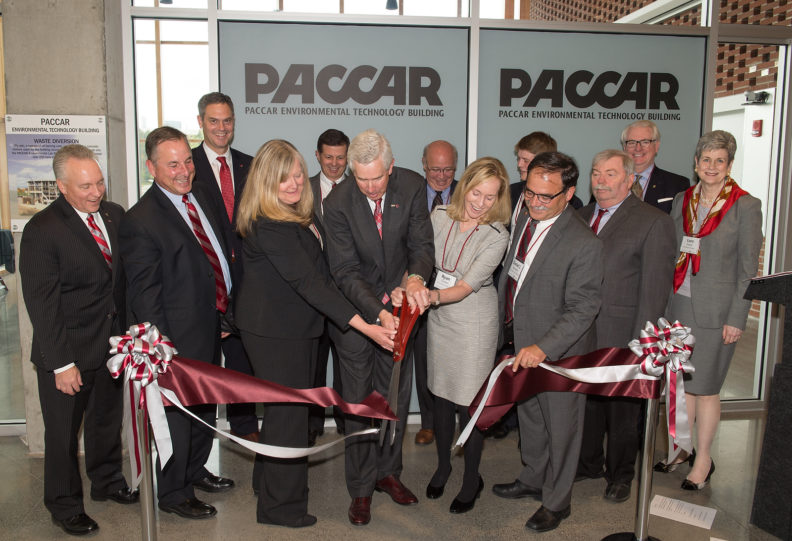 Center, Voiland College Dean Candis Claiborn, Mark Pigott, Executive Chairman of PACCAR Inc, WSU Board of Regents Chair, Ryan Durkan, and WSU Interim President Dan Bernardo cut the ribbon for PACCAR Environmental Technology Building dedication as WSU Board of Regents looks on.