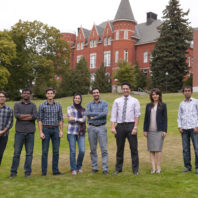 Professors Ali Hajbabaie and Leila Hajibabai, 2nd and 3rd from right, with graduate students. 