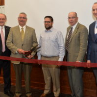Ribbon cutting for Kiewit Construction Management Classroom, from left to right: Don Bender, interim dean of Voiland College; Scott Cassels, executive vice president of Kiewit Corporation; Jason Peschel, program head, construction management; Max Kirk, associate professor, construction management; and Phil Gruen, director, SDC