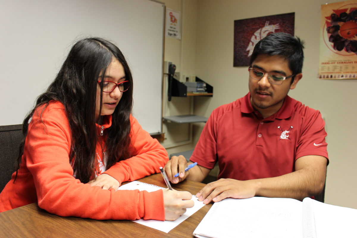 Ramiro and another student sitting at a table.