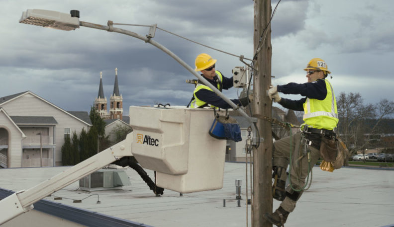 Installing air quality sensors in Spokane. Photo courtesy of Avista Utilities.