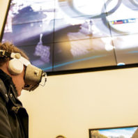 A WSU student takes a virtual trip to the 2018 Winter Olympics. (Photo Robert Hubner)