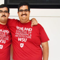 Joseph and Mario Guerrero standing side by side (Joseph is on the left, Mario is on the right).