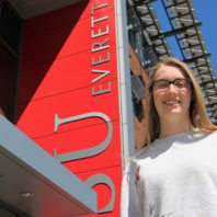 Haylie Murray standing outside a building on the WSU Everett campus.