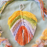 A leaf shape made of cut threads.