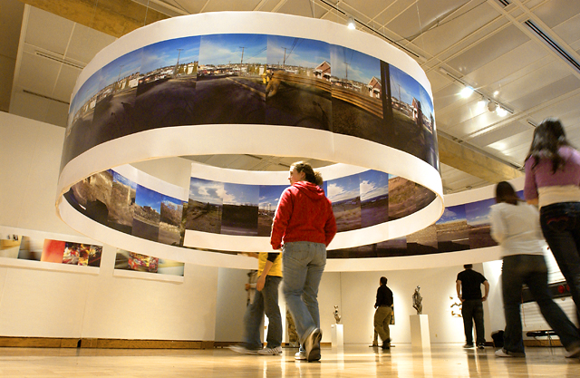 Image of students viewing art at a gallery.