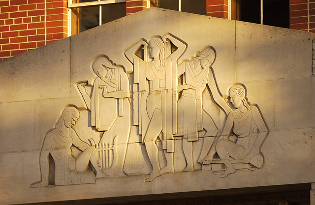 Image of female athletes stone relief sculpture