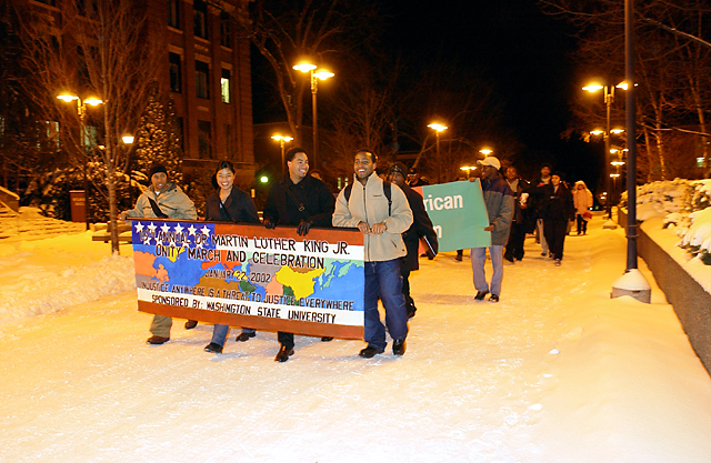 Image of students holding up signs at a Unity March.