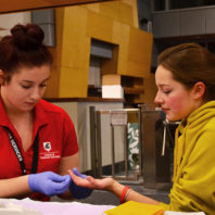 Facilitator helping student