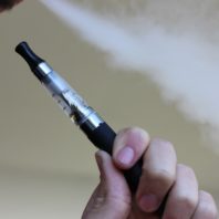 person using e-cigarette