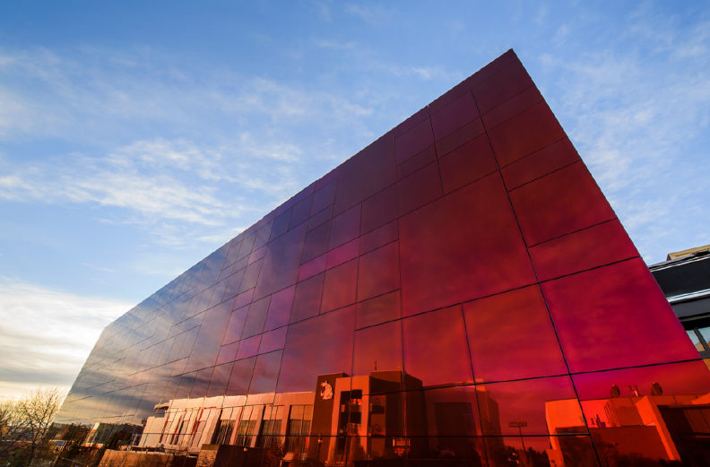 A photo of a large reflective red building