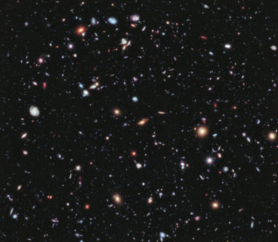 a photograph of many galaxies in space