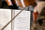 A photo of a music stand with music sheets