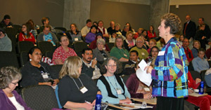 Horizons program director Doreen Hauser-Lindstrom talks with Horizons volunteers from across the state.
