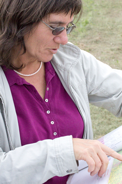 WSU Extension specialist Carol Miles checks a vineyard plot map.