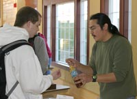 Grad student Richard Ramirez serves up a dollop of honey from Yemen; Yemeni honey has a distinct flavor unlike honey sold in the U.S.