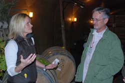 karma-tour Julie Pittsinger of Karma Vineyards talks with viticulture certificate student David McKeller about making sparkling wine with the traditional Methode Champenoise. Photo by Bob Hoffmann/WSU.