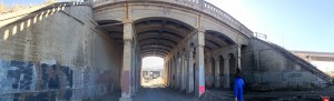 A pillared East Central underpass could become a connecting pathway, said WSU instructor Steve Austin, right. His students are finding ways to link Spokane neighborhoods as a class project.