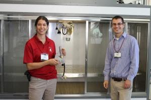 Tara Lewis and Kevin Squires, graduate students studying Crop and Soil Sciences, show off the facility’s new high-tech spray chamber, which will enhance herbicide studies.
