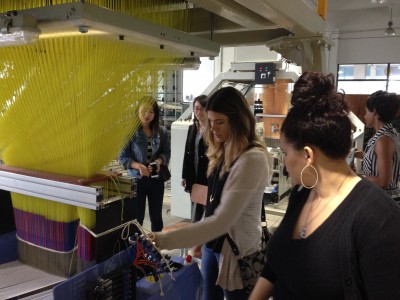 Alison Dephillips and Nikki Norman inspect a 3-D weaving machine at Donghua University, Shanghai.