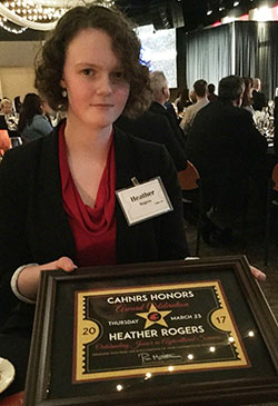 Heather Rogers shows off her Outstanding Junior in Agriculture Award at CAHNRS Honors.