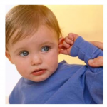 The image shows a toddler pulling on his ear, a common behavior when children have ear aches.
