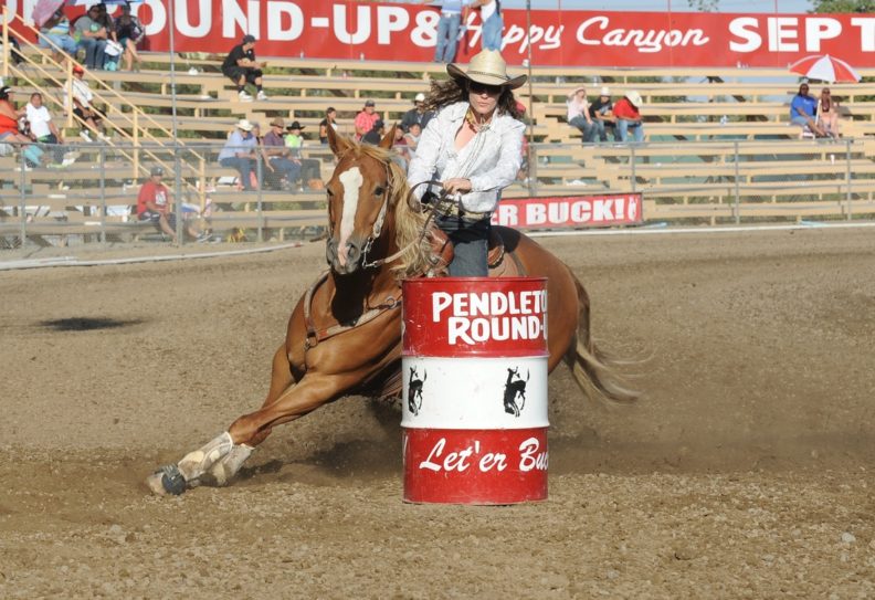 Jillian Connolly riding Sugar in a barrel race