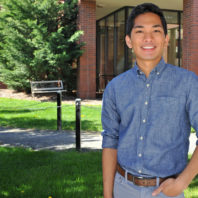 Josh standing in front of the WSU veterinary teaching hospital