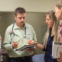 Mike Burdette talking with students