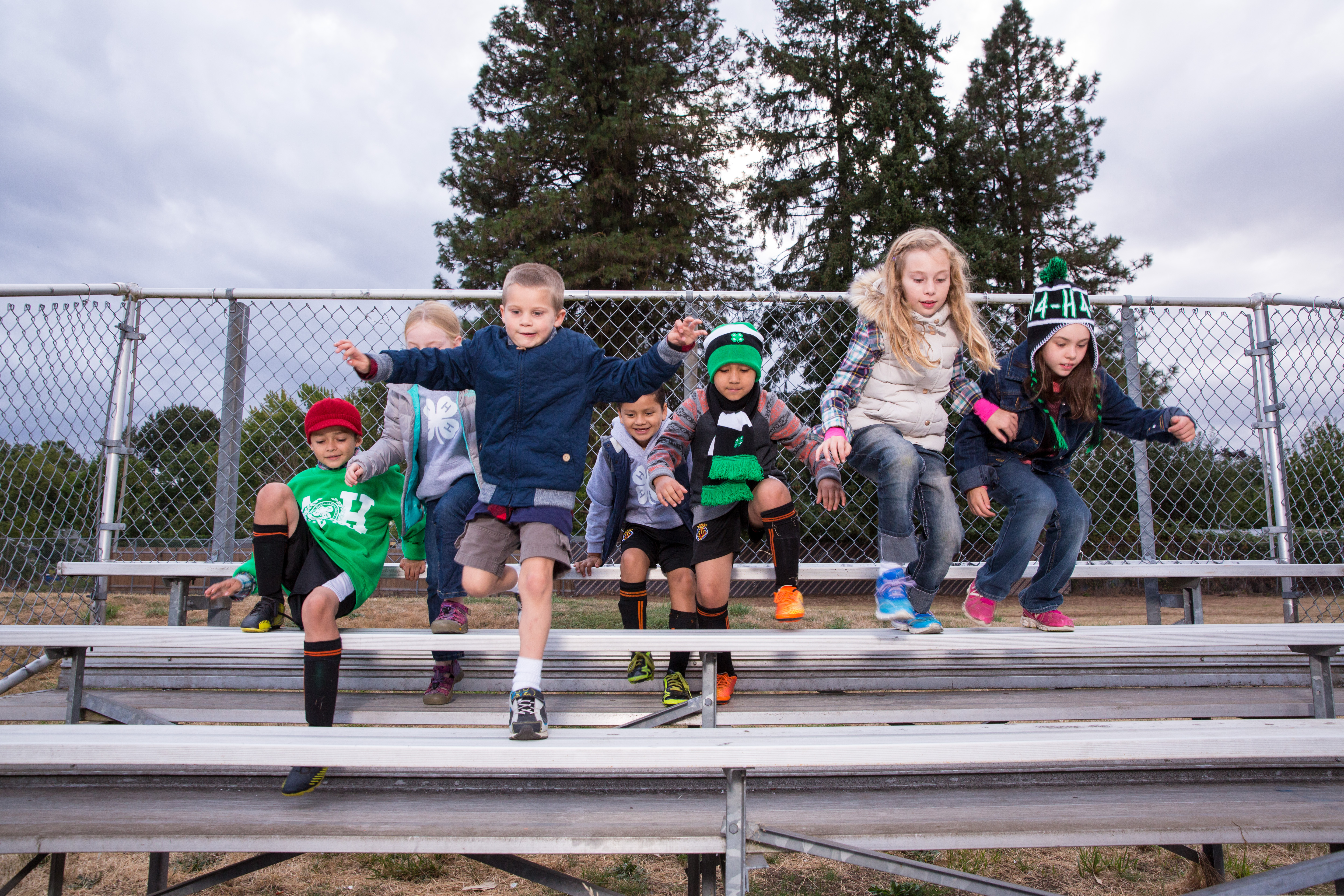Youth Climbing down the bleachers.