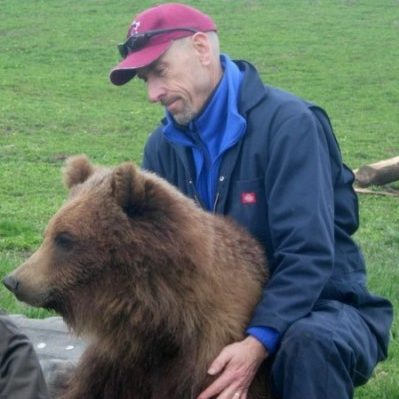 Charles Robbins with a bear.