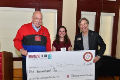 Student, sponsor and College of Business dean with award check