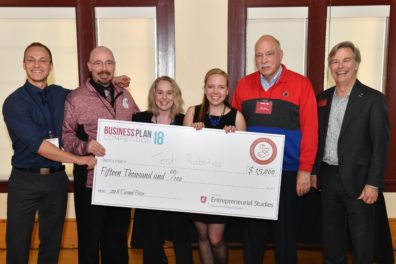 Student, sponsor and College of Business dean with award check