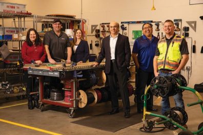 Sequoyah Electric President Mahmood Ghassemi, third from right — with, from left, Michele Amato, Tim Ostlie, Cheryl Nagel, Thurman Woods and Ryan Cruth.