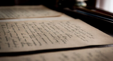 Cursive script written on aged paper. 