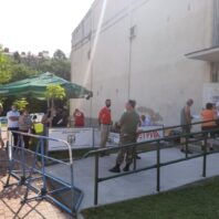 people standing in line outside a building